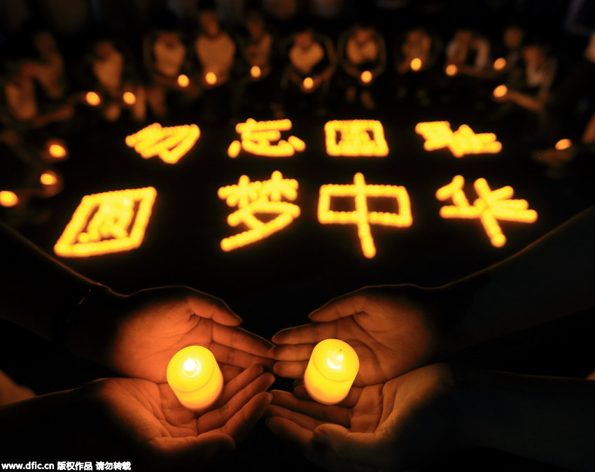 High school students light candles to commemorate V-Day