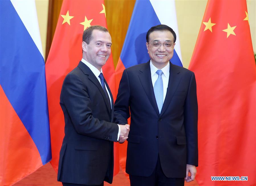 China, Russia sign over 30 deals during Medvedev visit