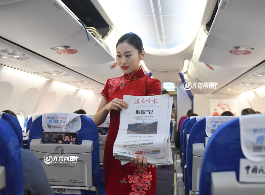 Flight attendants in cheongsam send new year wishes to passengers
