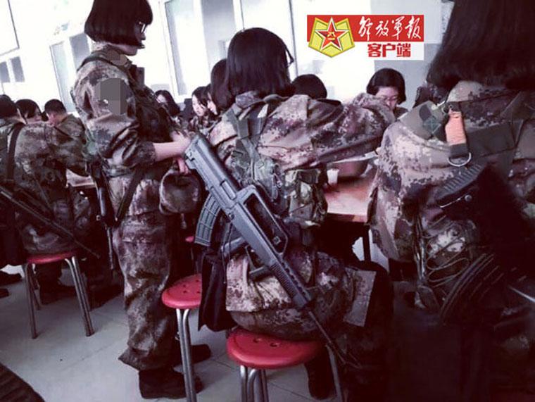 Versatile female soldiers in military camp
