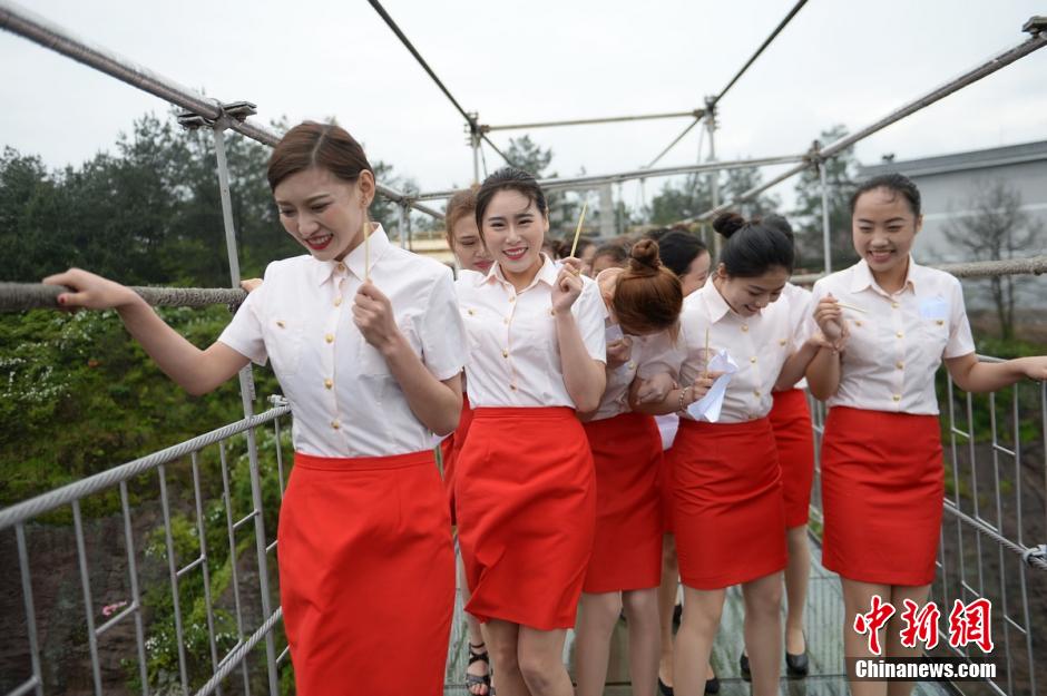 Etiquette training on all-glass suspension bridge