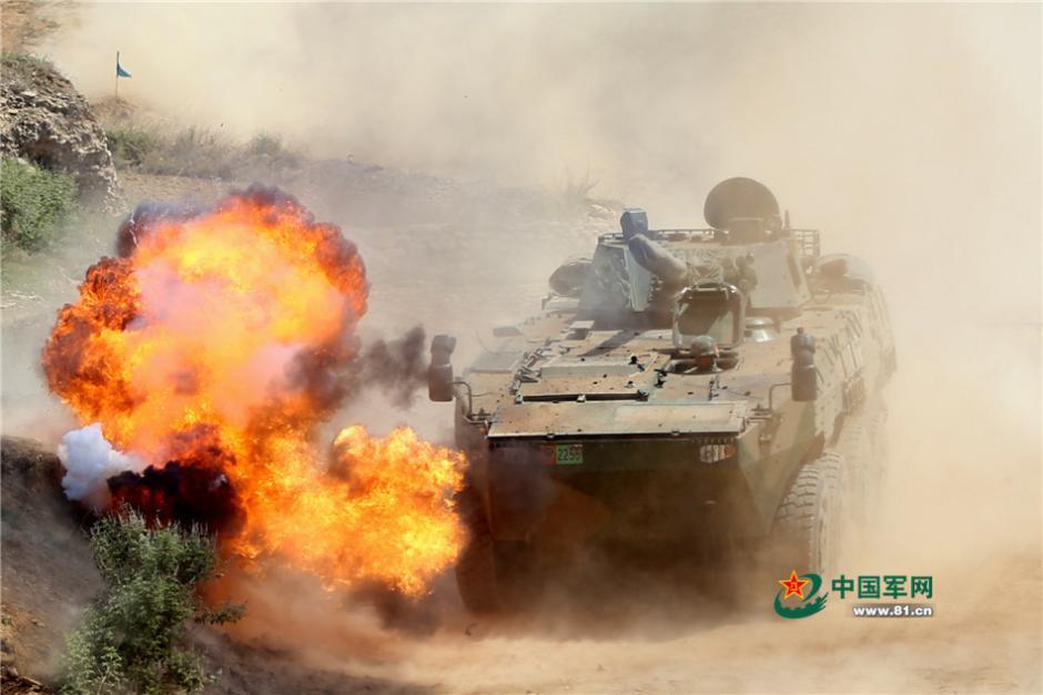 Soldiers driving eight-wheeled infantry fighting vehicles in combat training