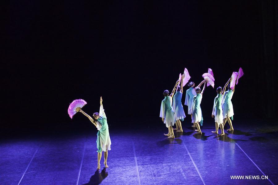 Performers dance during the dancing show 'Heaven, Earth, People' in Rome, Italy, Dec. 10, 2016. The show 'Heaven, Earth, People' is directed by Two Chinese students Zheng Lu and Jiang Churui, who graduated from Beijing Dancing Academy.