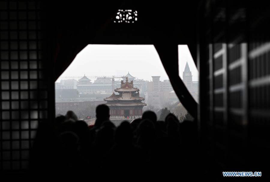 Visitors view snowy scenery at Palace Museum in Beijing