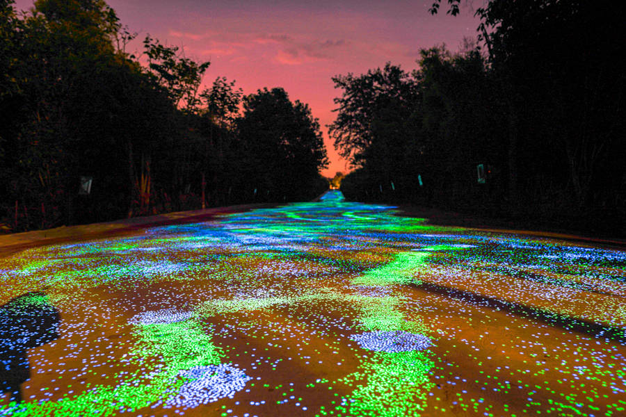 Fluorescent footpath glows under the night sky in Chongqing