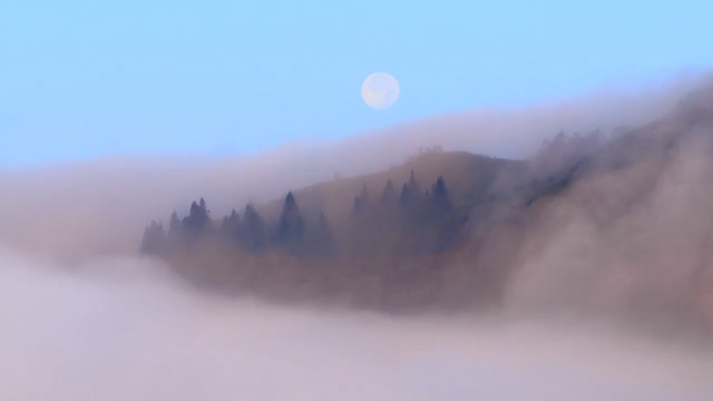 Moon hangs over pink cloud in Chongqing