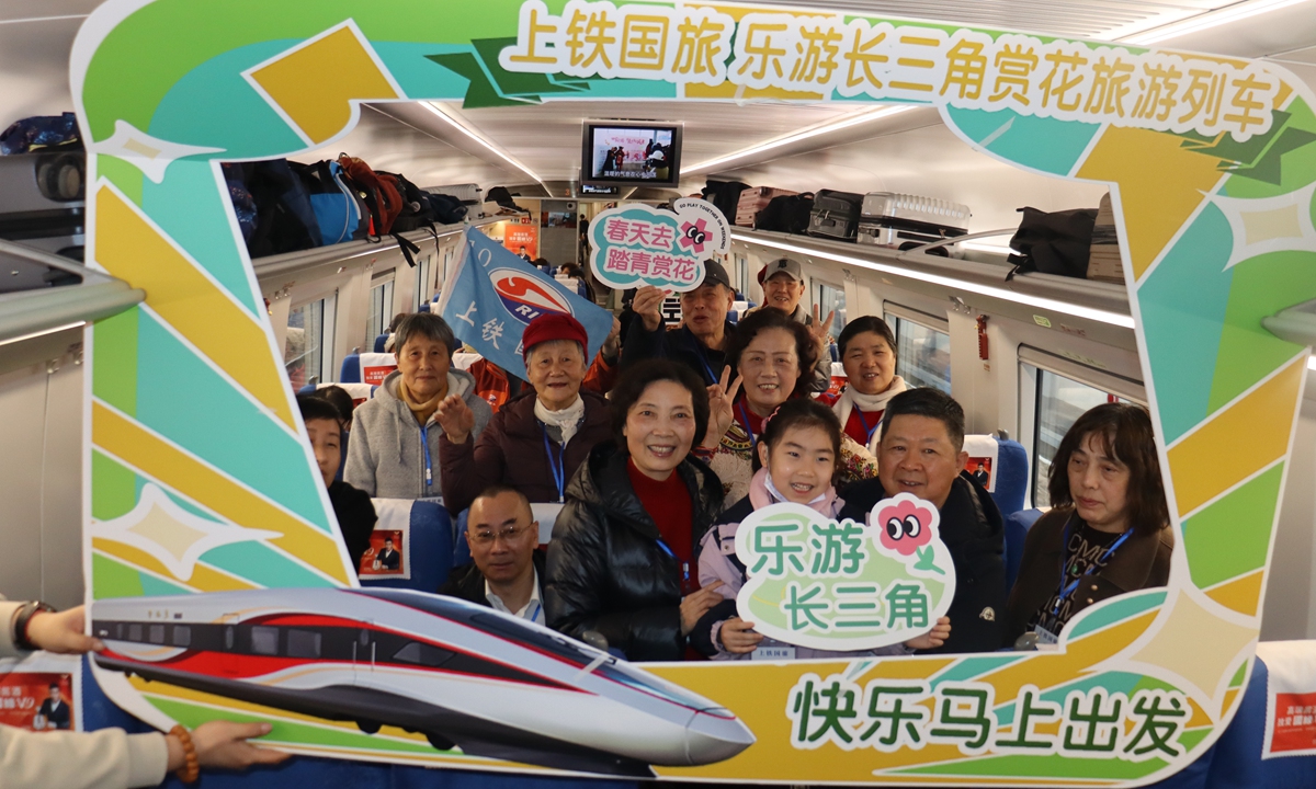 Passengers pose for photo at a