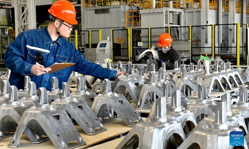 Workers check aluminum alloy components at a company in Binzhou, east China's Shandong Province, Feb. 26, 2025. Binzhou City is a major hub for private enterprises. In recent years, the city has fostered the development of private economy through comprehensive and end-to-end services. (Photo: Xinhua)