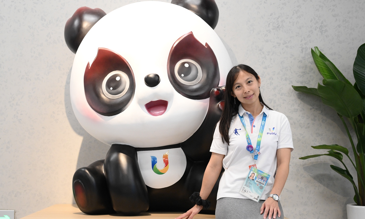 Zhao Jing poses with Rongbao, the mascot of the Chengdu FISU Games at the main media center of the Games on August 2, 2023.Photo:Chen Tao/GT