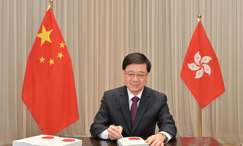 The HKSAR CE John Lee signed the Safeguarding National Security Ordinance on March 22,2024. Photo: Courtesy of the HKSAR government