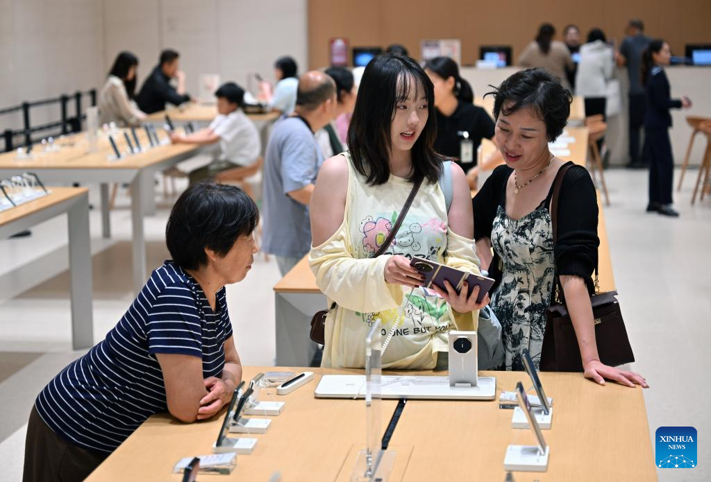 Customers shop at duty-free shopping mall in Sanya, China's Hainan